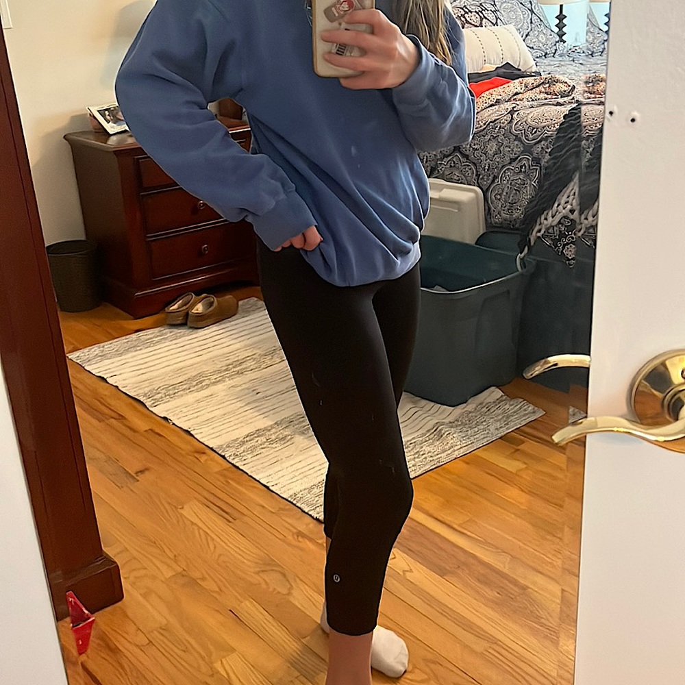 black lulu lemon capris with pockets on each side size 4